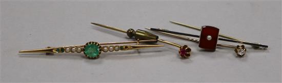 An early 20th century yellow metal, seed pearl and emerald bar brooch, a 15ct? gold bar brooch and two stick pins